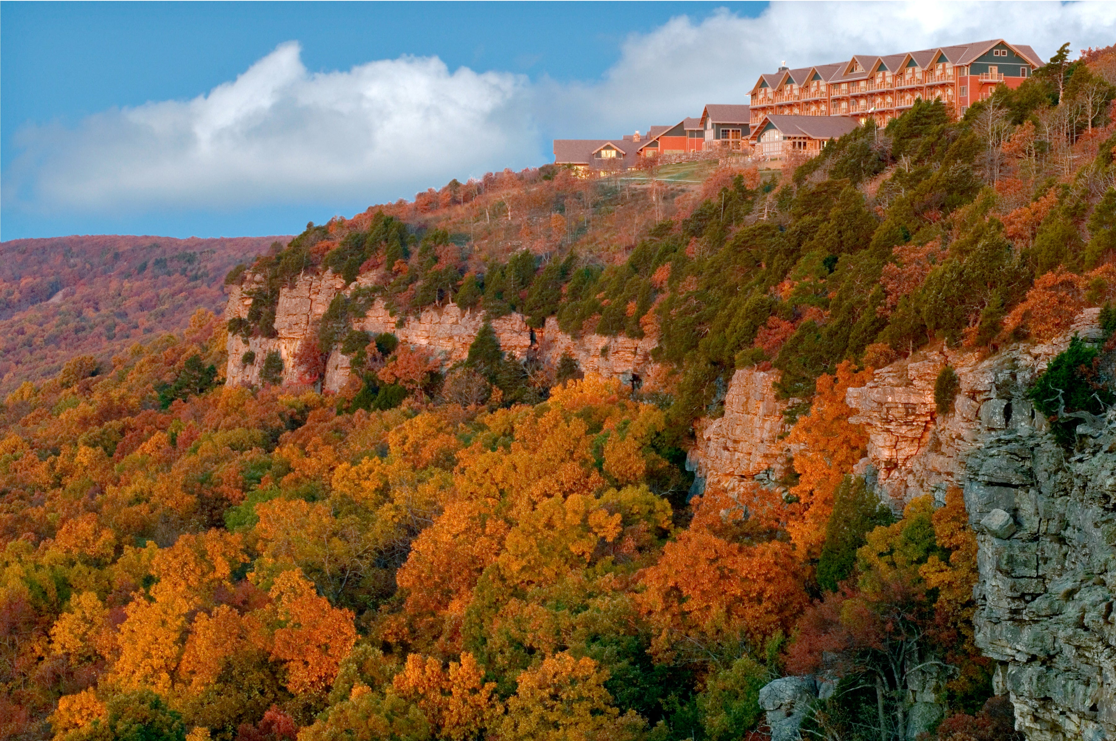 Mount Magazine State park lodge with beautiful fall foliage on the mountainside